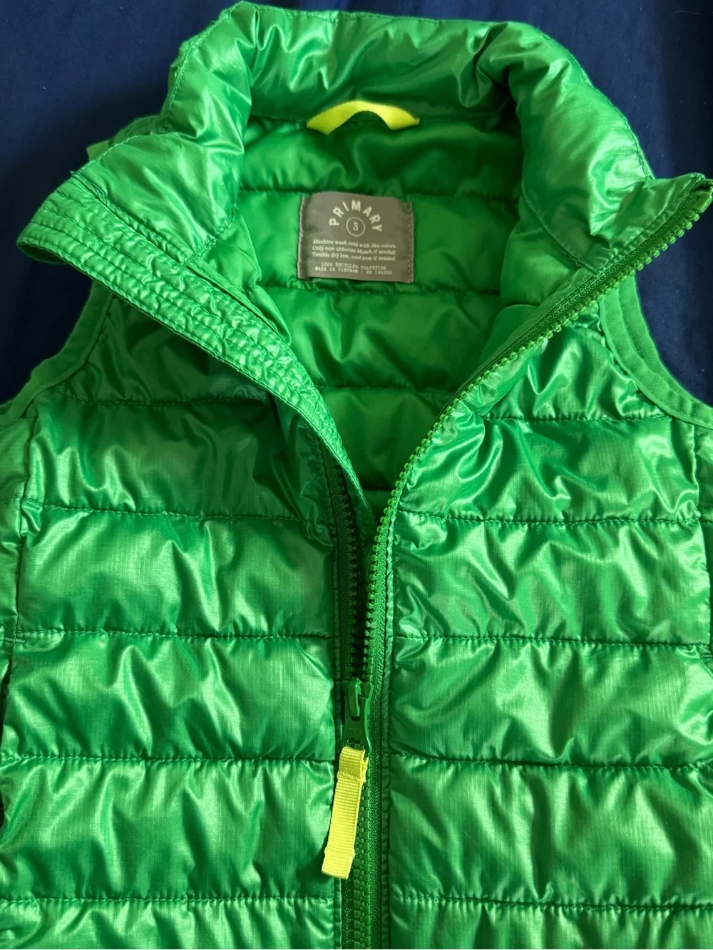 Primary Green Quilted Sleeveless Puffer Vest with Yellow Zip Pull